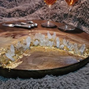 Custom charcuterie board w epoxy and crystal details. Rich gold, cream, bronze.